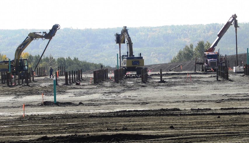 Crews installing foundation piles for the worker accommodation camp on the north bank of the Site C dam site.
