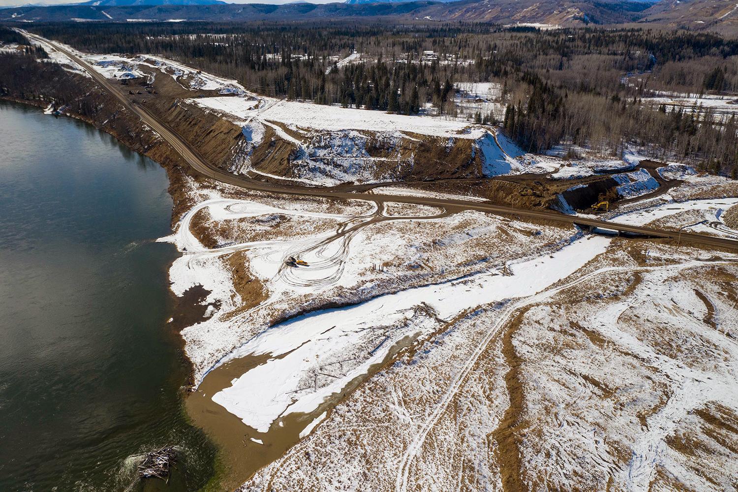 Aerial photo of the Highway 29 realignment at Lynx Creek showing work underway on the west abutment. | March 2021