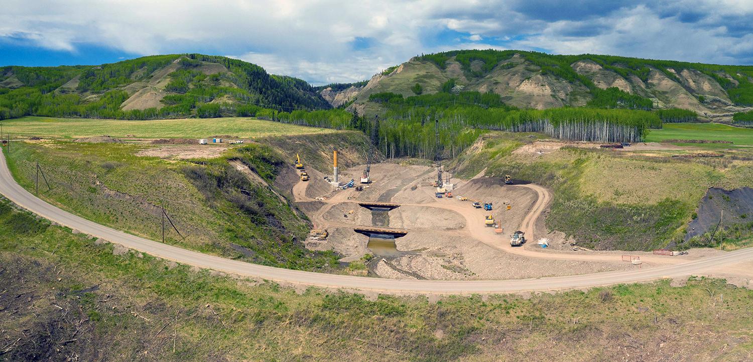 Construction is underway on the 1.5-kilometre-long section of Highway 29 at Dry Creek. Crews are also installing rock anchors and constructing concrete bridge foundations on the new 158-metre-long bridge. | May 2021