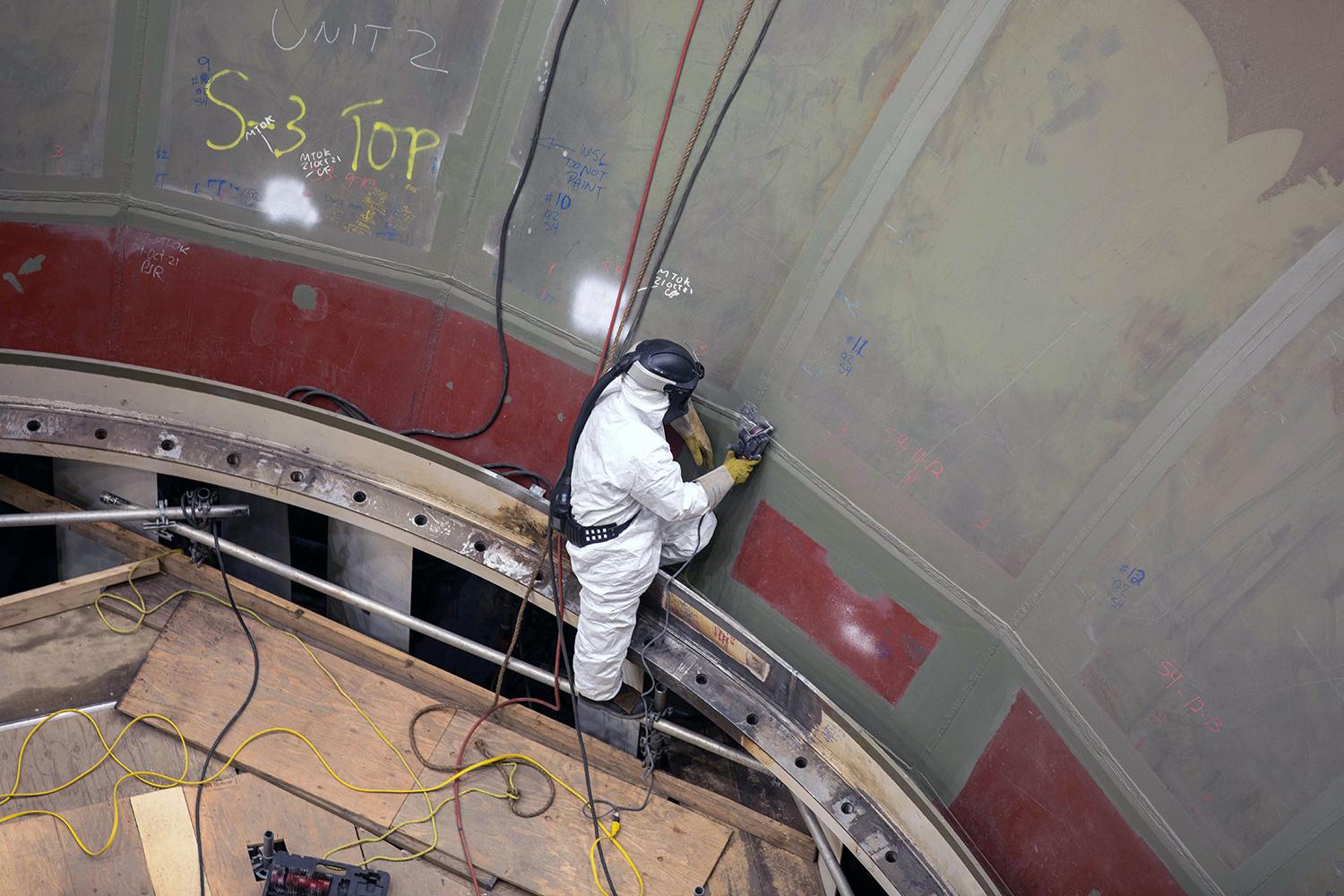 Using a bristle blaster to prepare and paint the surface of unit 2 spiral case. | October 2021
