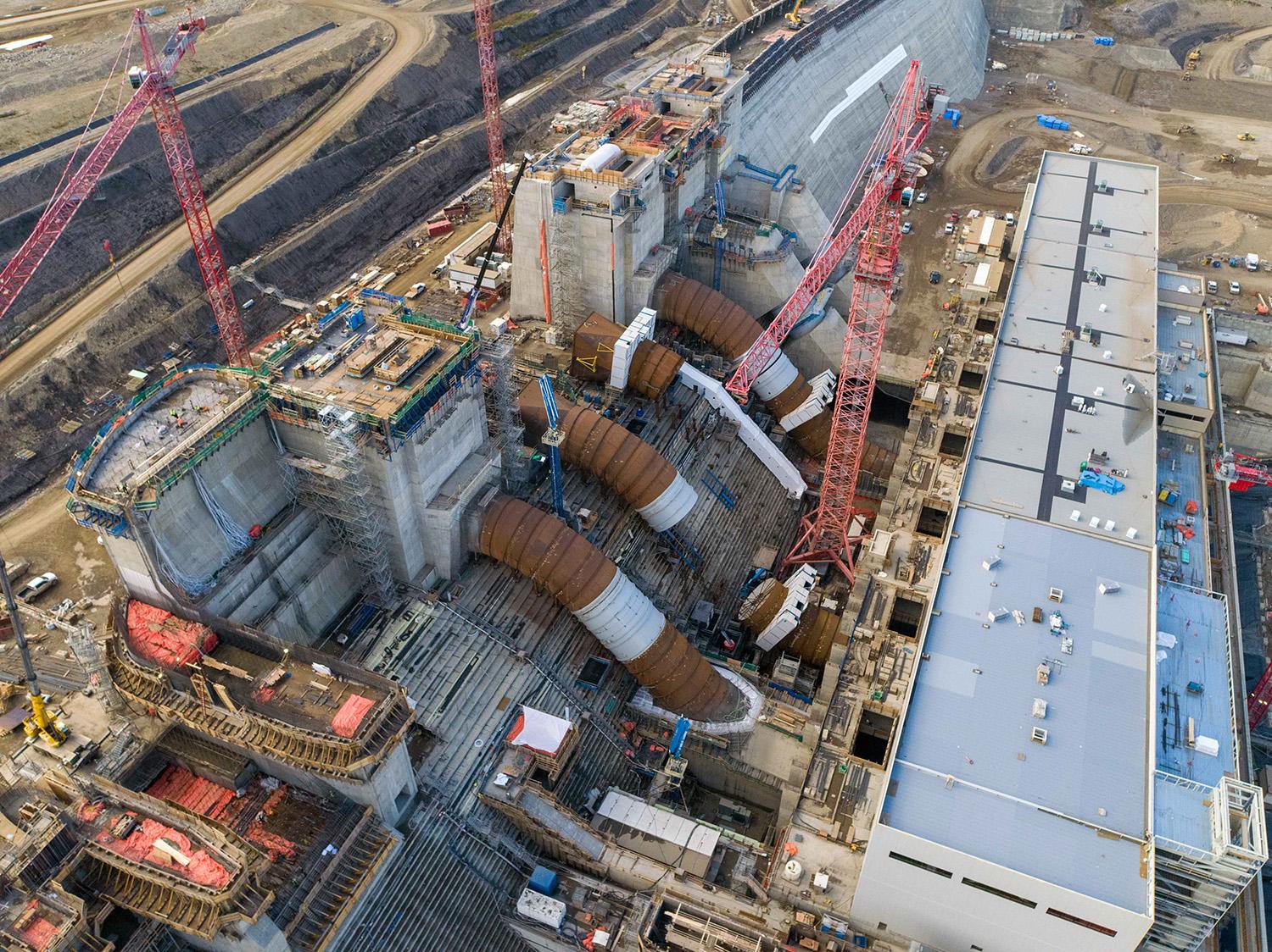 Penstock construction is ongoing. The large segment pieces have been completed on units 1 through 3, and unit 6. Welding is ongoing on penstock units 3 through 6. |September 2021