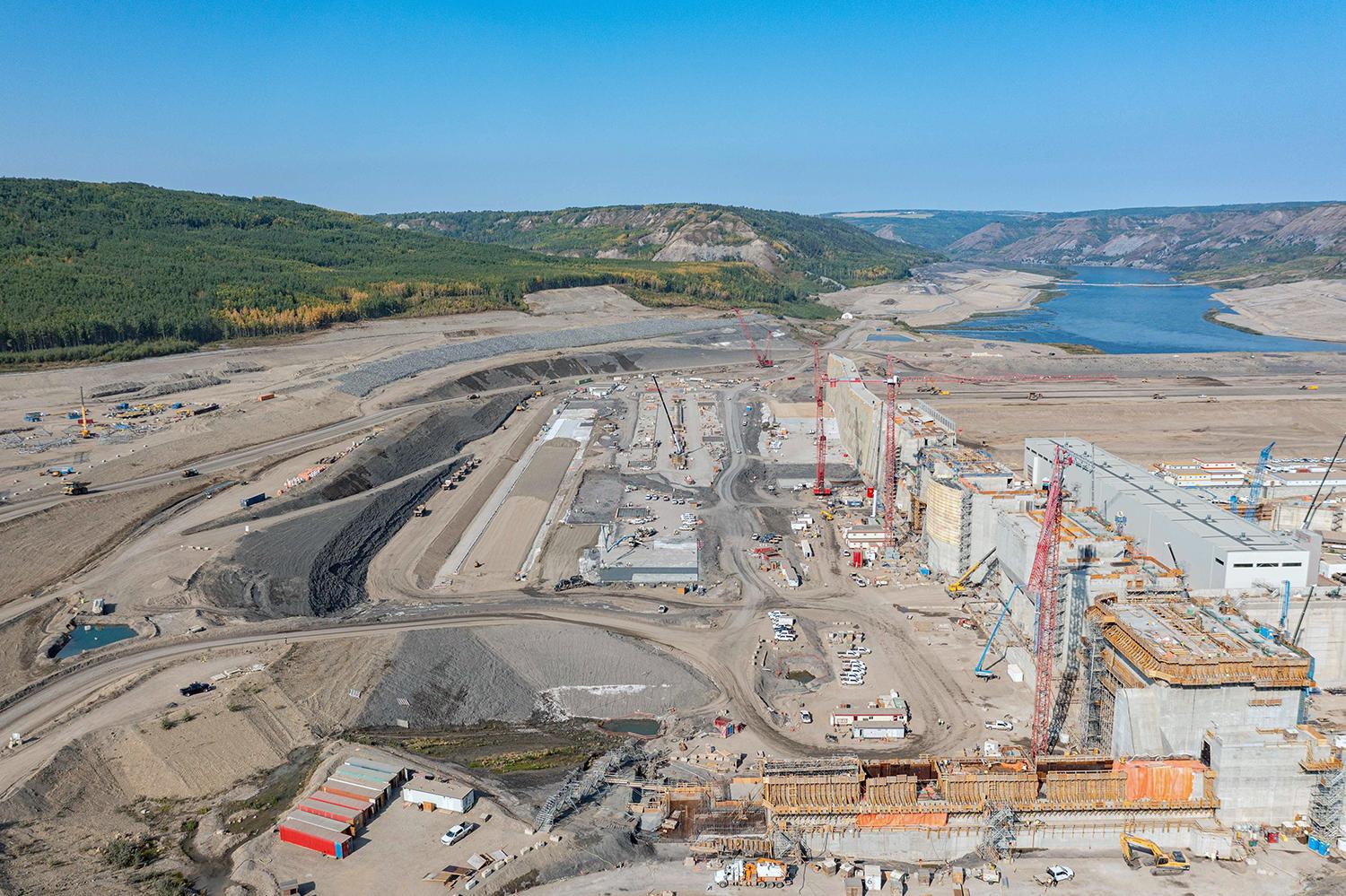 West-facing aerial view of the approach channel, intakes, and powerhouse. | September 2022
