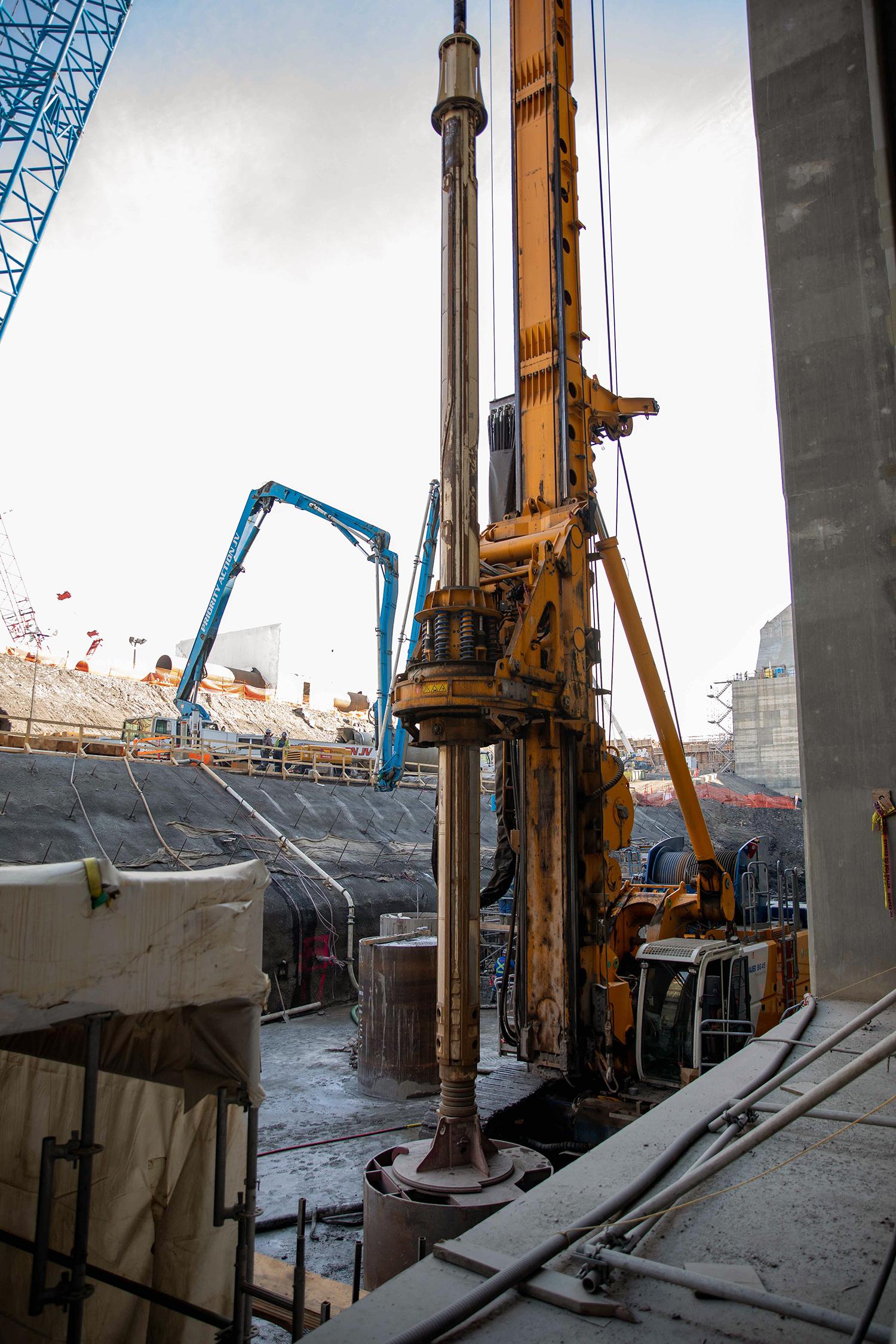 A pile driver is used to core holes 60 inches in diameter and 40 metres deep, as part of foundation enhancement at the tailrace. ! September 2022