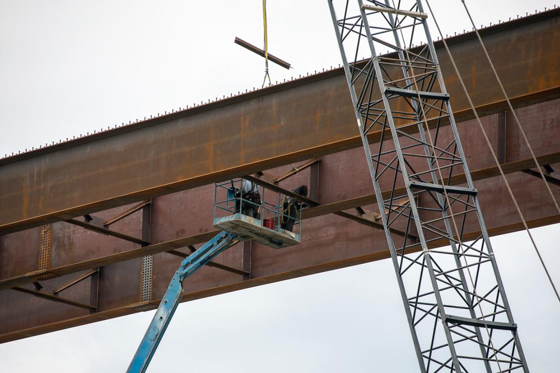 Steel cross-bracing is installed between the Dry Creek bridge girders. | August 2021