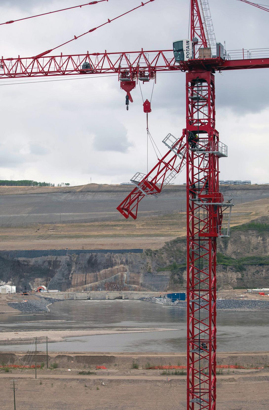Dismantling the access assembly platforms on a newly erected tower crane at the spillway basin. | May 2021