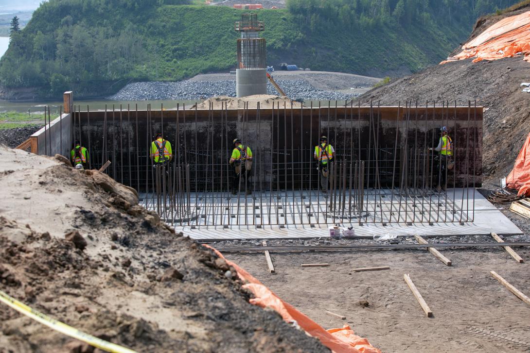 Workers install rebar for the east abutment of the Farrell Creek bridge on Highway 29. | July 2021
