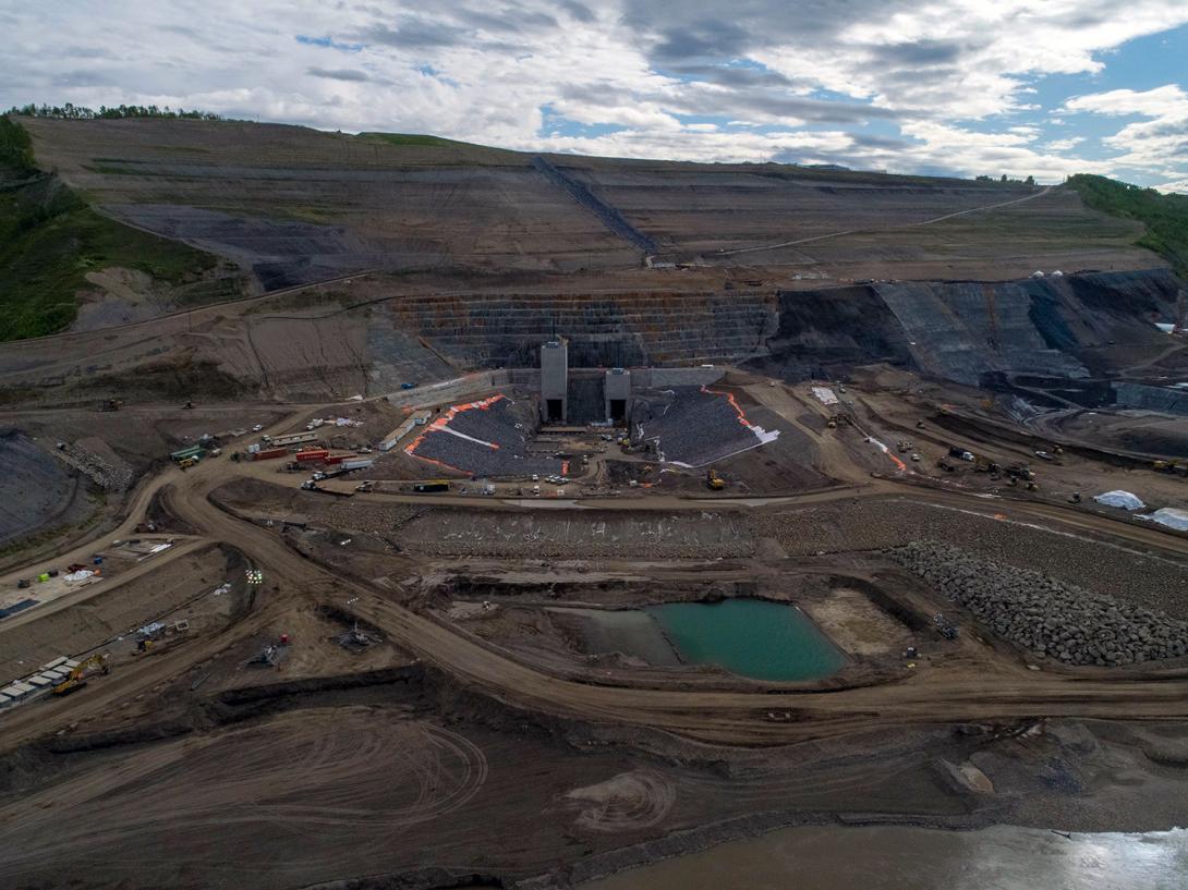 North bank overview of the completed diversion tunnel inlets, with channel, inlet cofferdam, portals and gate structures. | May 2020