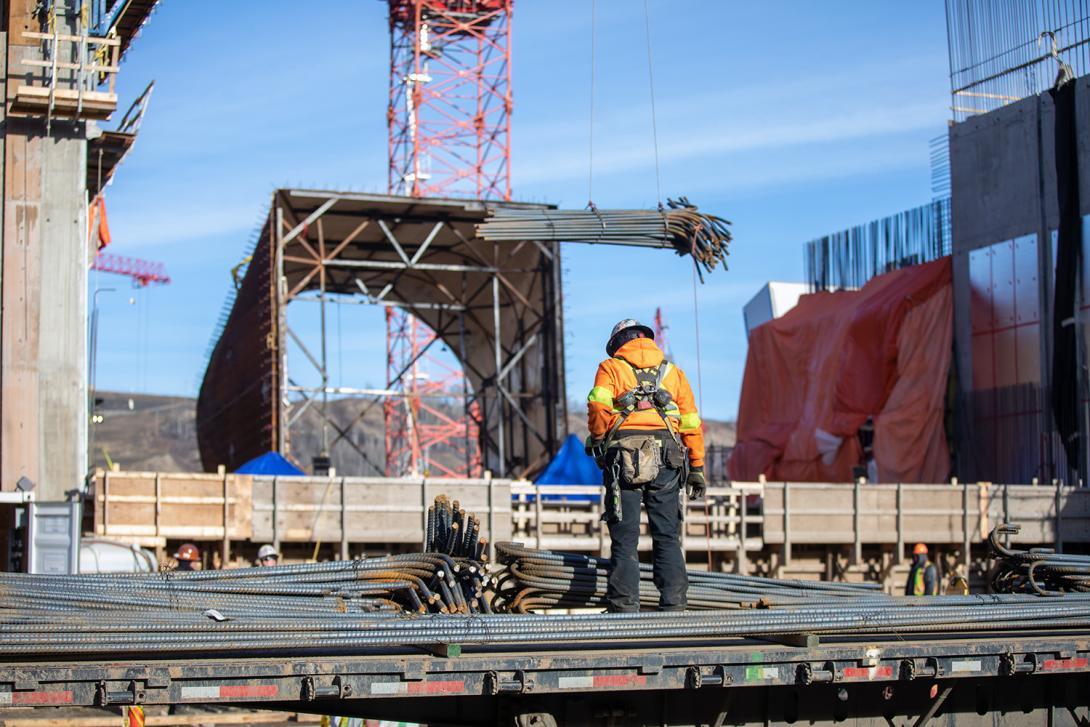 Rebar is being delivered at the intake area where it will be used to reinforce the concrete intake structures.  More than 5,000 tons of rebar will be installed in the six intake structures. | October 2019