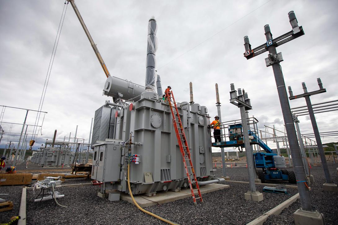 Workers connect a transformer for the Peace Region Electrical Supply (PRES) system – located at the Site C substation. | June 2020
