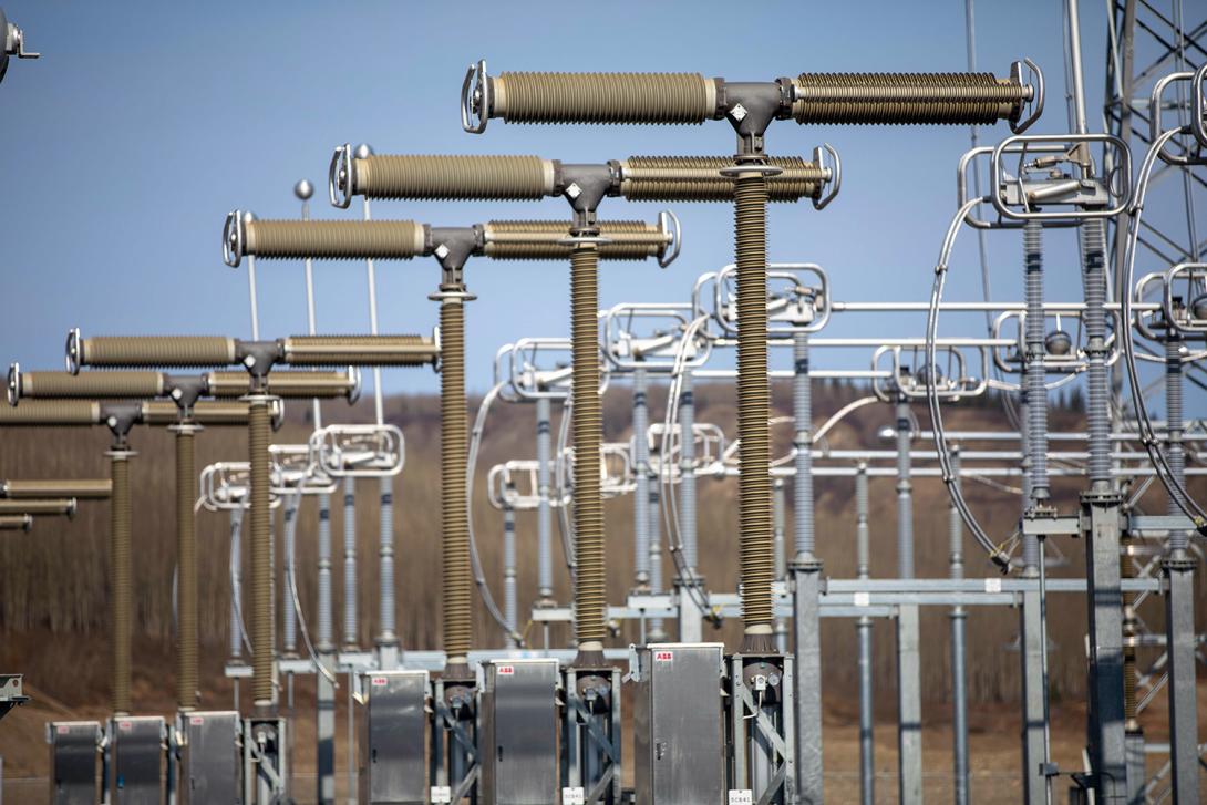 The 500 kV circuit breaker poles at the substation are assembled and ready for testing and commissioning. | April 2020