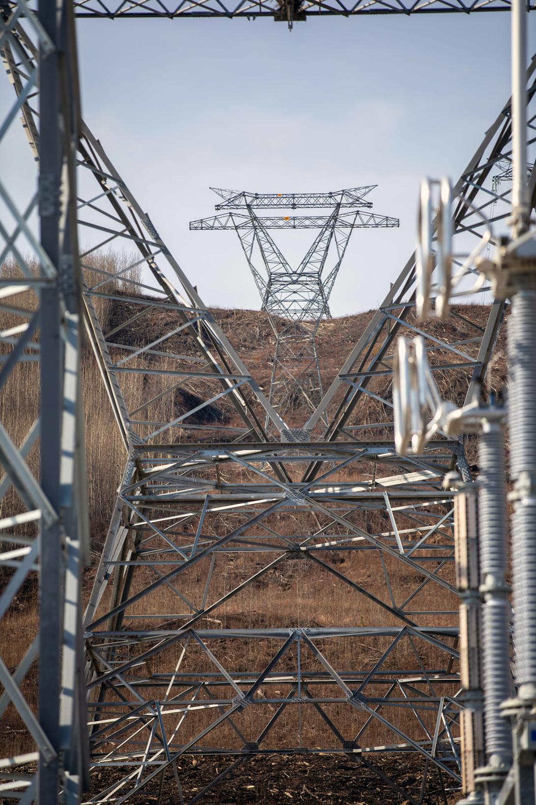 The first three of two hundred 500kV towers on 5L6 are installed in the right-of-way leaving the Site C substation. | April 2020 