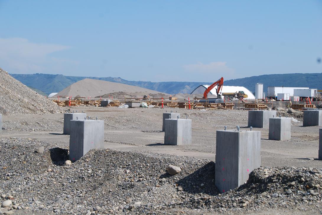 Concrete pedestals and concrete being poured in forms for the substation | August 2018