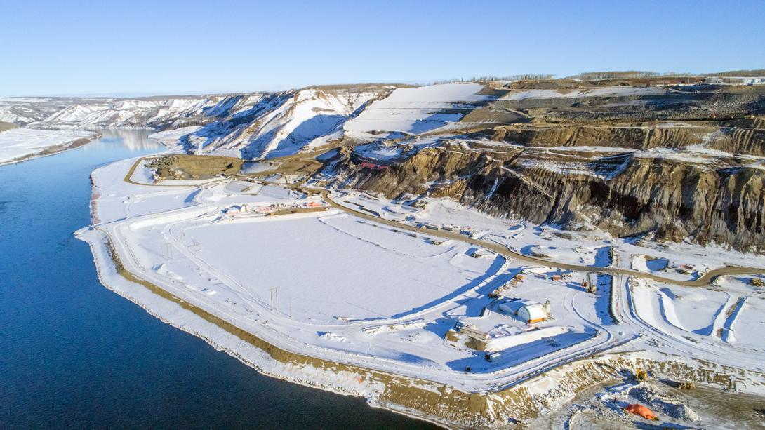 Aerial view of the north bank with cofferdam and excavation, facing northwest | February 2018