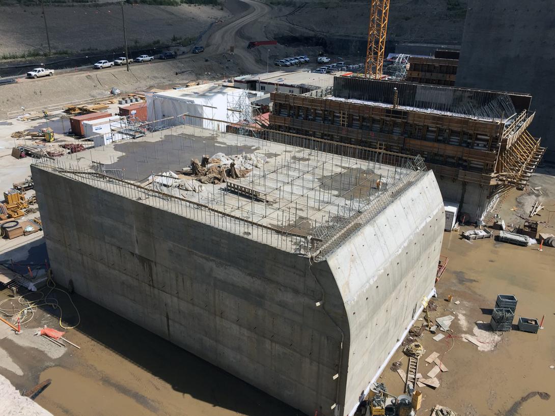 Stilling basin weir under construction at the spillway. This structure dissipates the water’s energy before it flows downstream into the Peace River. | July 2020