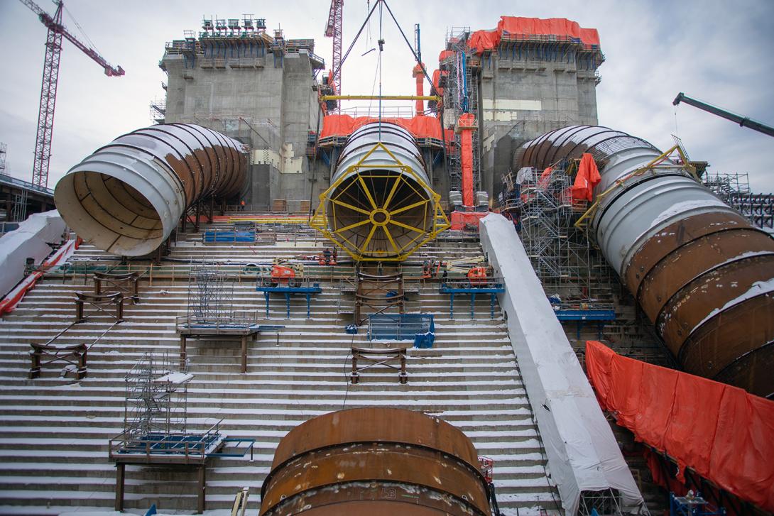 A penstock piece is lowered into place as part of the penstock installation for Unit 2. | December 2020