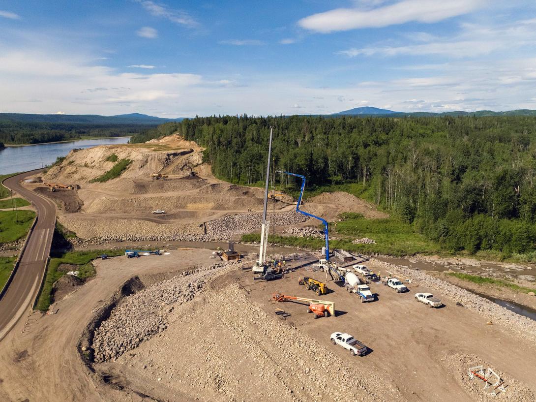 Crews pour concrete on the east abutment of the Lynx Creek alignment on Highway 29. | June 2021