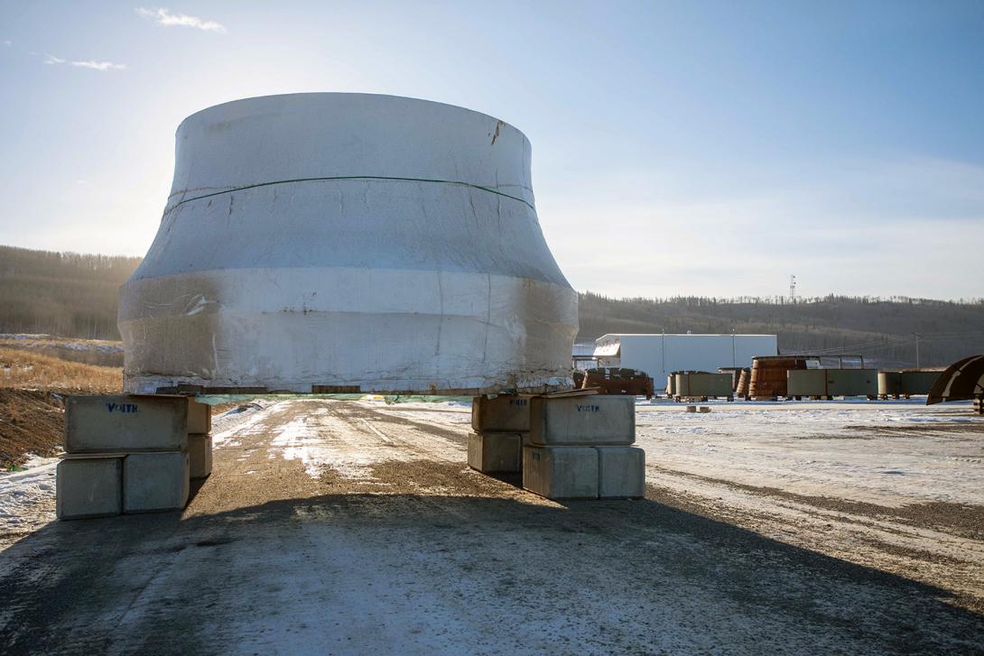 The first turbine runner was transported from Prince Rupert to site in mid-January, where it sits in storage until its installation next year. | January 2021