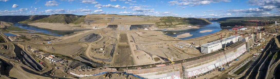 Panorama of the Roller Compacted Concrete (RCC) dam and core buttress with construction of the dam core in the background. |September 2021
