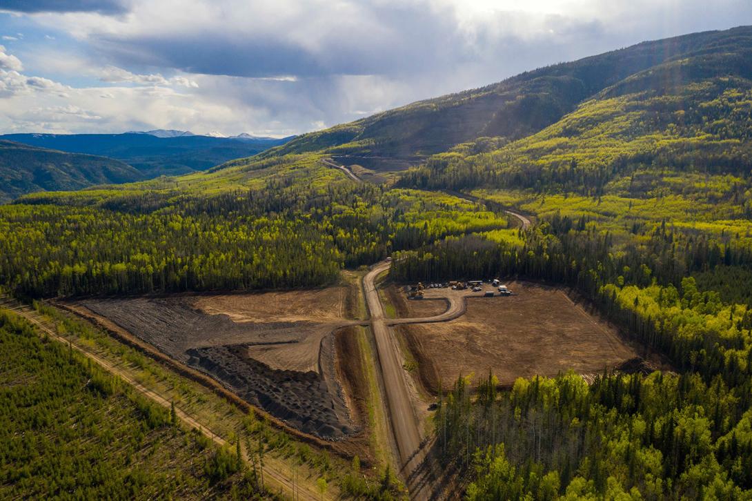 The Portage Mountain Quarry is a source of rock materials used for various segments of the Highway 29 realignment construction. Also pictured are the haul road and stockpile area. | May 2021