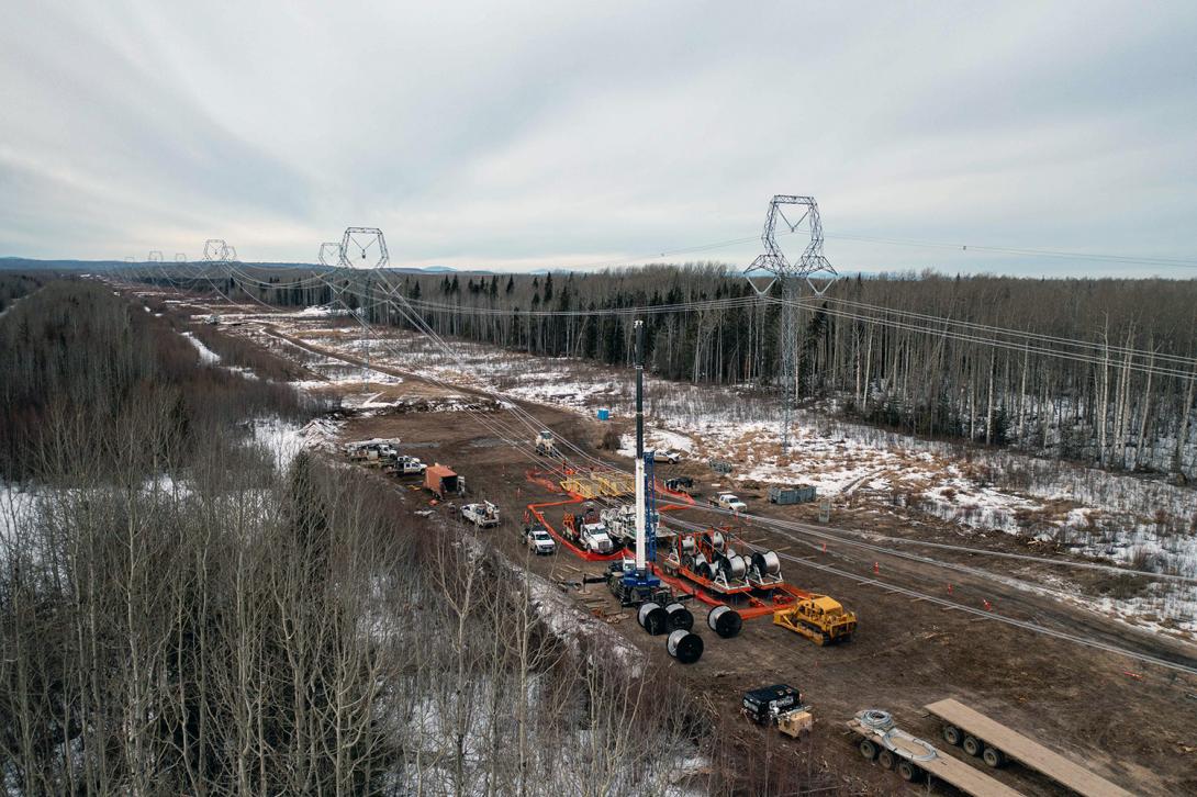 Along the transmission line is a midspan-splice site where the conductor reels are not long enough to complete a span. | February 2022