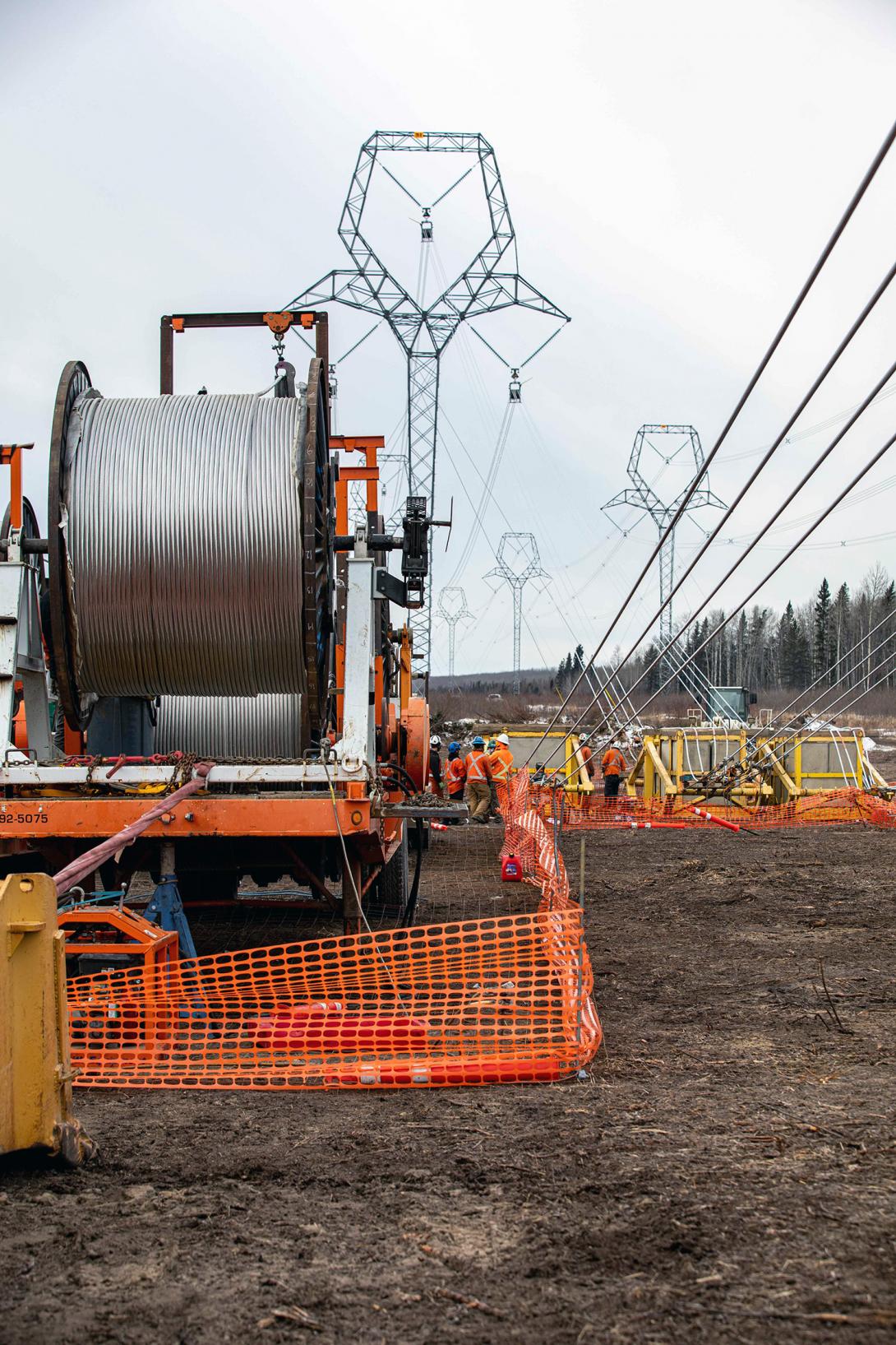 A crew is working on the midspan site of the transmission line. | February 2022