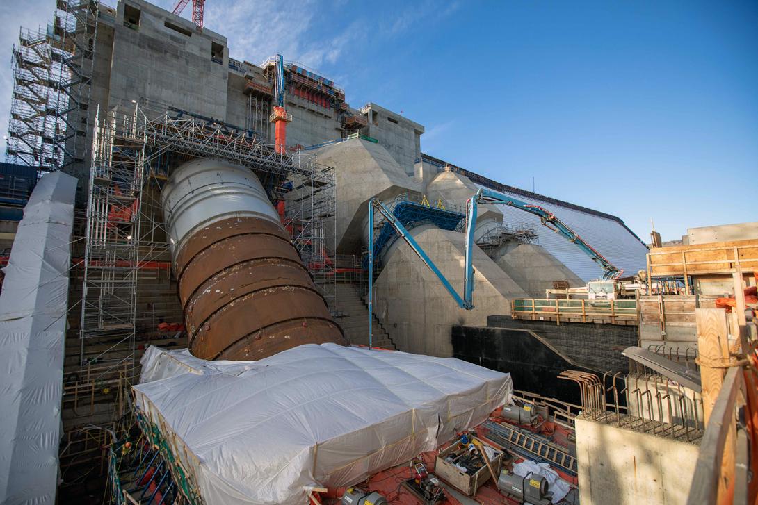 A casing boom applies concrete at penstock unit 3. | October 2021