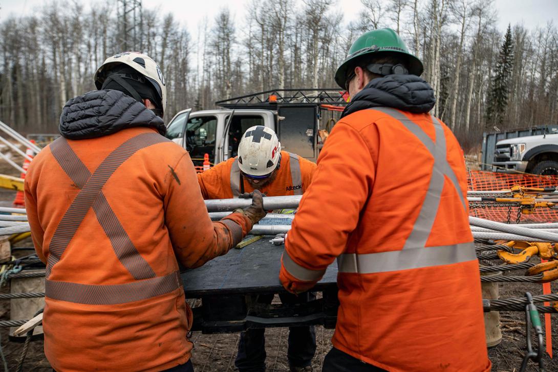 A crew is inspecting the midspan splice installation on the transmission line. | February 2022