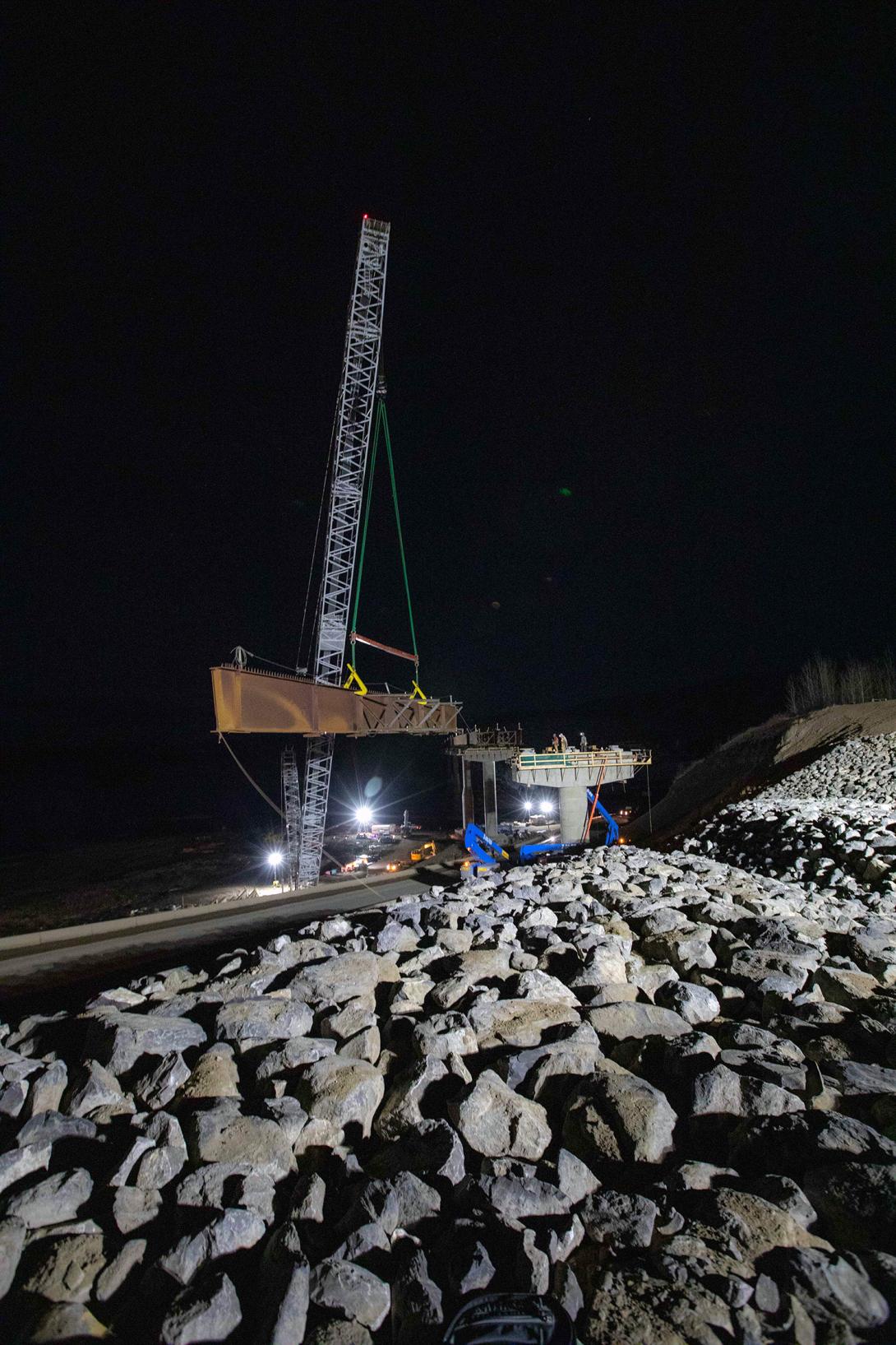 Crews work overnight to install the first girder for the Farrell Creek Bridge realignment on Highway 29. | March 2022