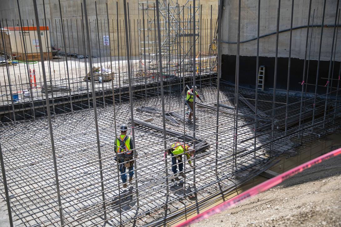 Crews install rebar at the left stilling basin. | July 2022