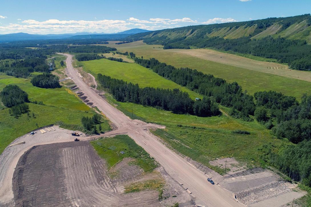 Aerial view of construction taking place for the Lynx Creek highway alignment. | July 2022