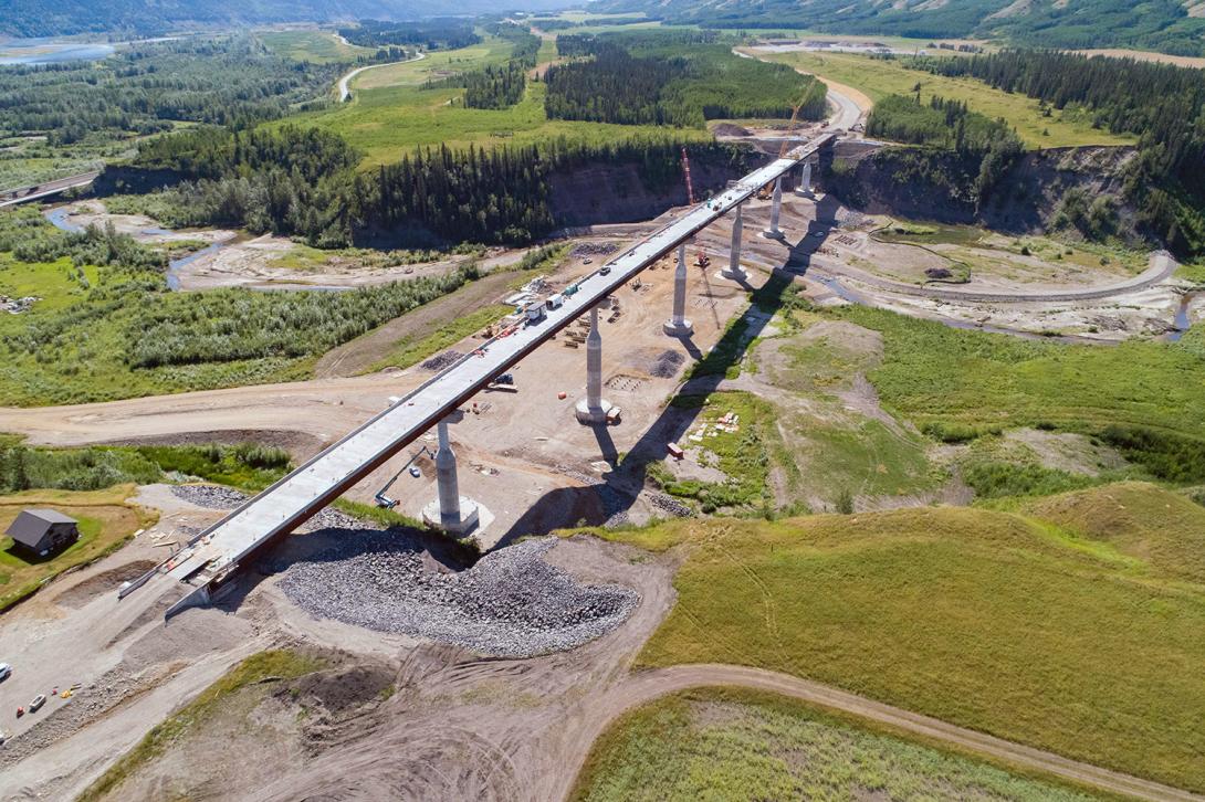 Aerial view of the Cache Creek bridge, showing five of seven concrete deck pours completed. | July 2022
