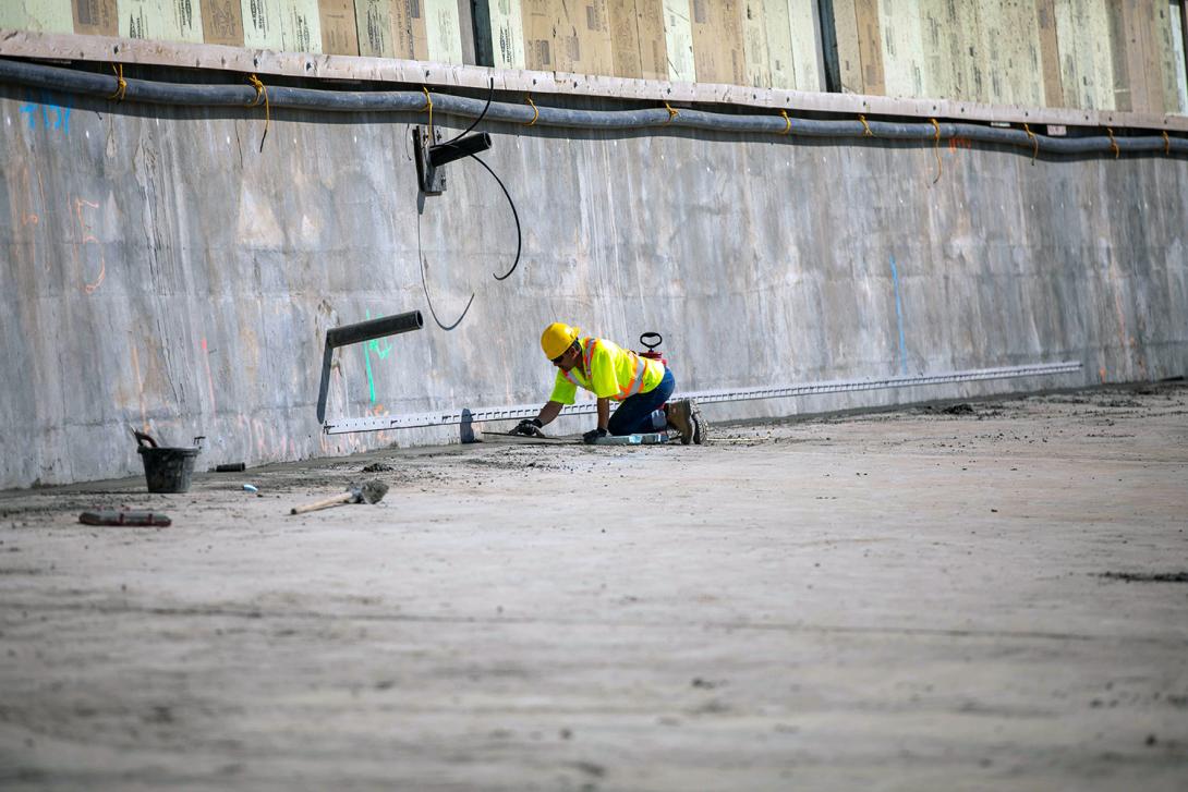 Grouting and patching the roller compacted concrete dam and core buttress where the liner will be attached. | August 2022