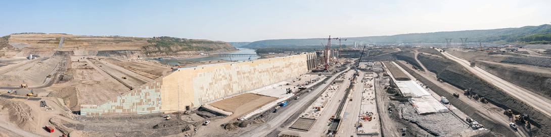 A panorama view, facing east, of the approach channel with the dam core on the far left. | September 2022