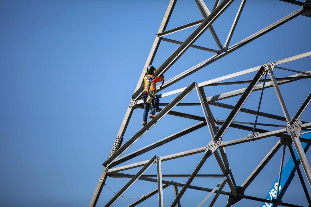 Transmission towers are installed to connect the Site C substation to the dam. | August 2022