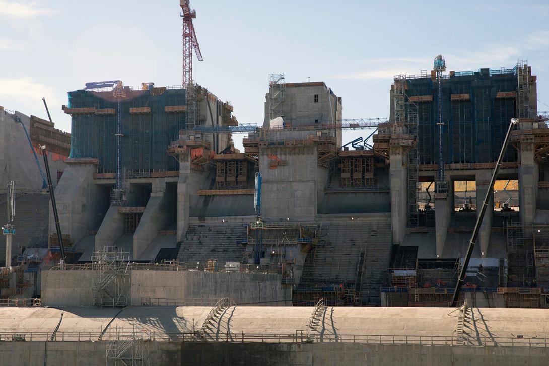 Spillway upper headworks, lower-level outlet gates with the stilling basin weirs in foreground. | September 2022