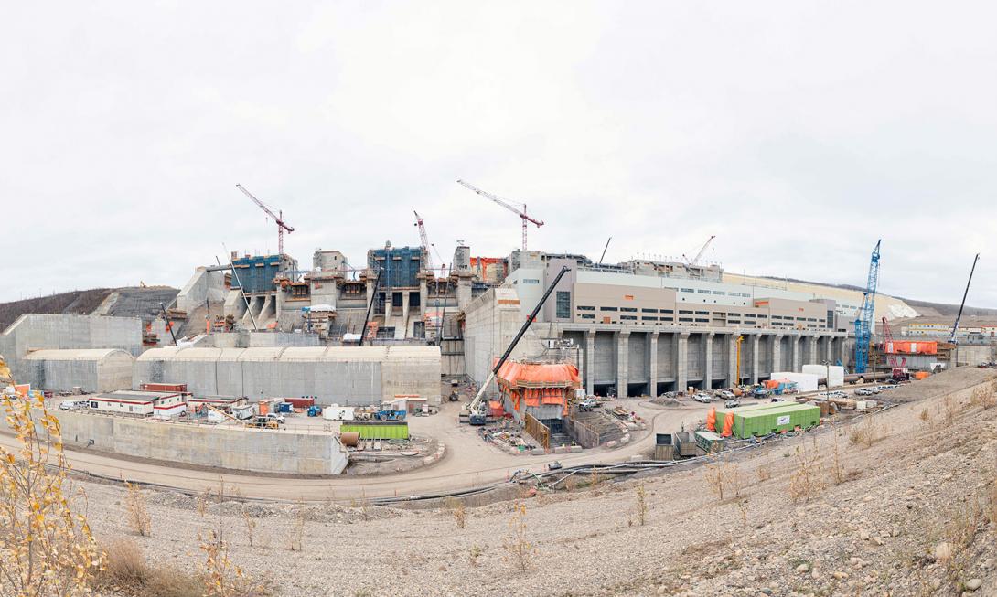 Panorama of the spillways, stilling basin weirs, and 12 tailrace galleries, where water flows out of the powerhouse. | November 2022