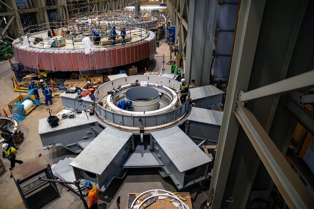 Unit 1 is in the background with the unit’s lower bracket in the foreground, where the generation bearing is being installed. | January 2023