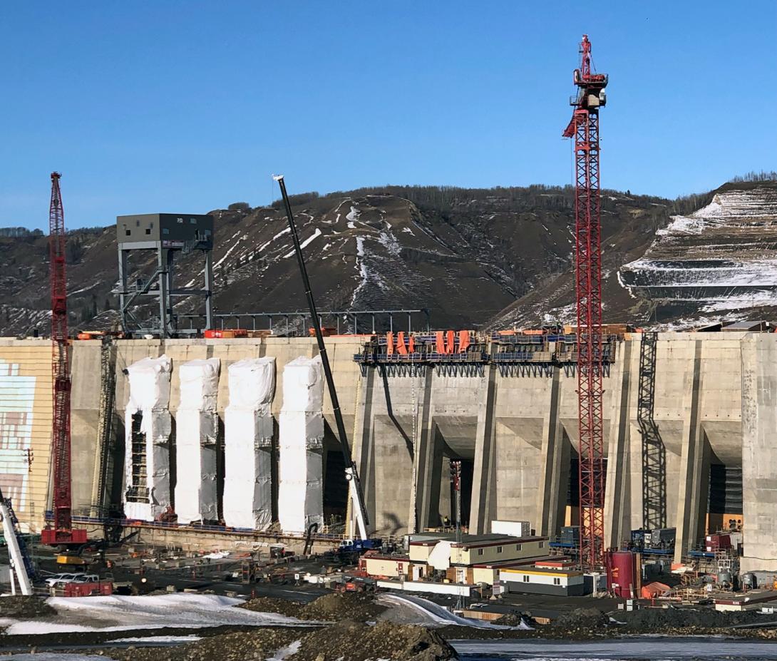 Water will flow from the approach channel into the six intake gates. It will then travel down the penstocks into the turbine units to generate electricity. | February 2023