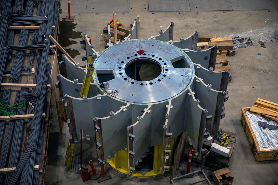 The centre section of unit 3 rotor assembly is in the main service bay of the powerhouse ahead of installation. | March 2023
