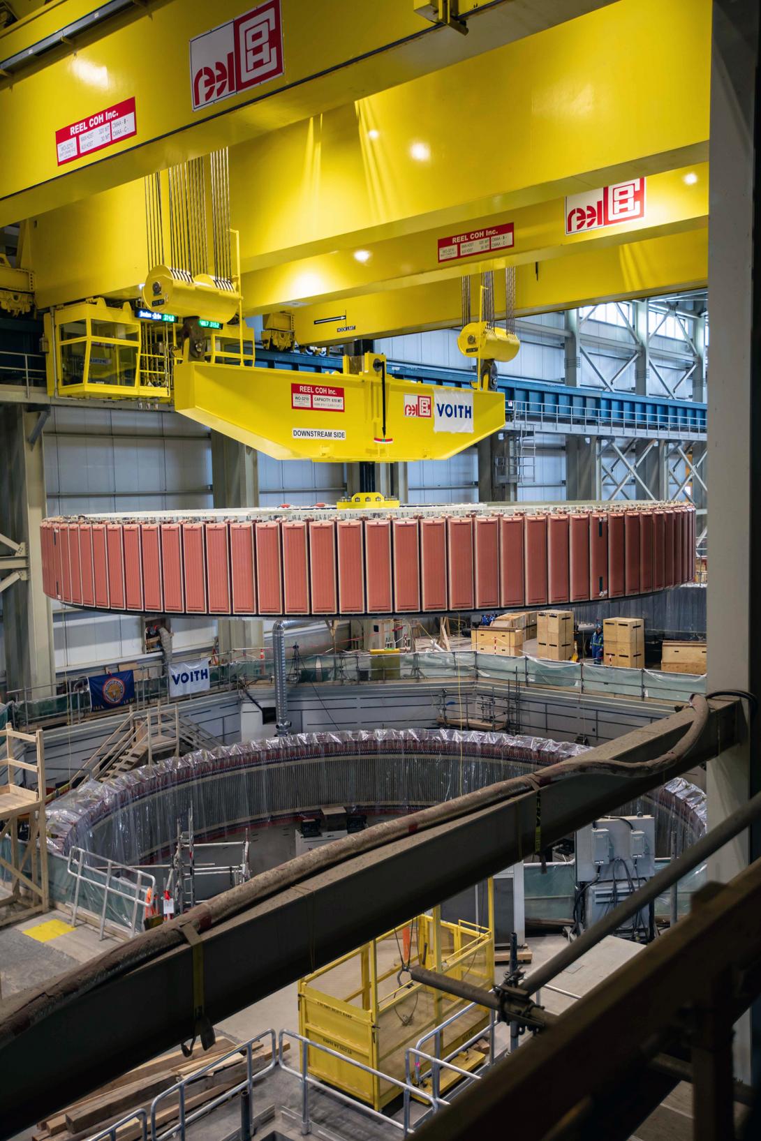 During the Unit 1 rotor lift, it is moved over the generator pit to be lowered into position. | February 2023