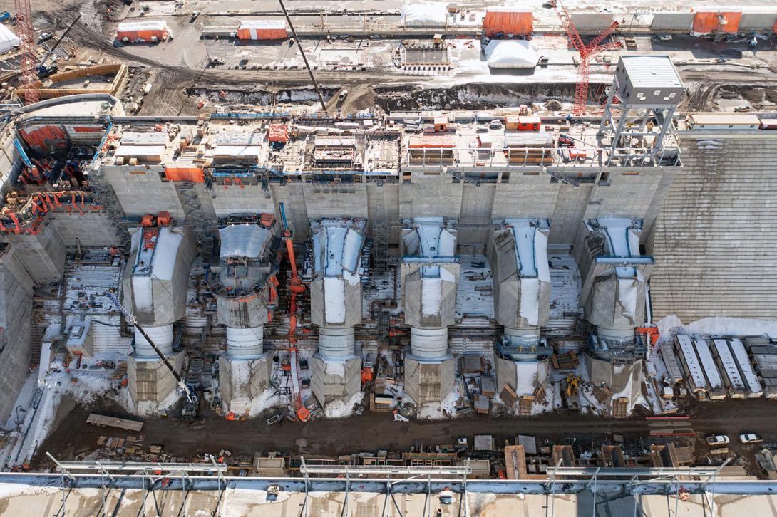 Water will flow through these six penstocks down into the powerhouse, where it will turn the turbines to make electricity. | March 2023