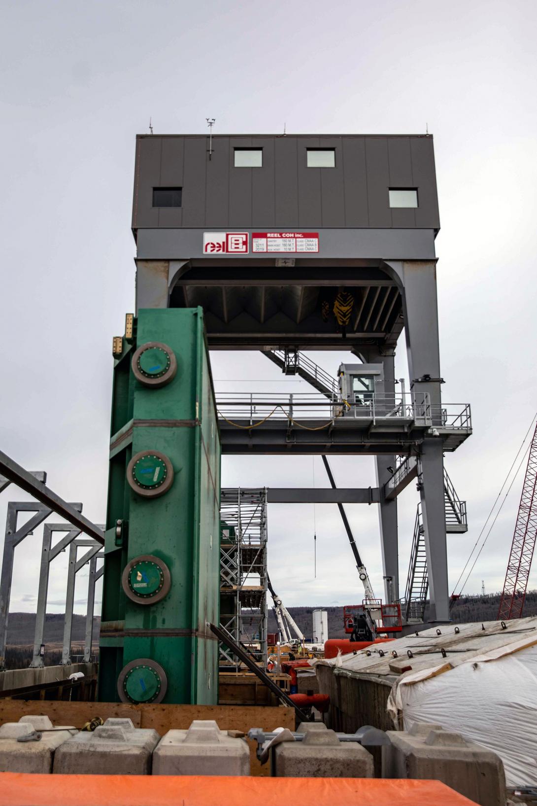 An operating gate is on the intake platform below the intake gantry crane. Each of the six intake units will have a gate that will be raised and lowered by the gantry crane. | April 2023