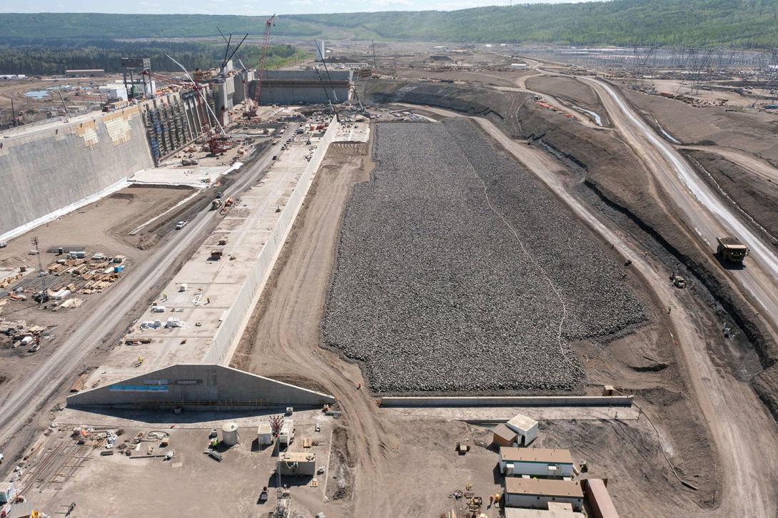 Downstream view of the approach channel. Water will flow from the reservoir into the channel, towards the intakes and spillways. | May 2023