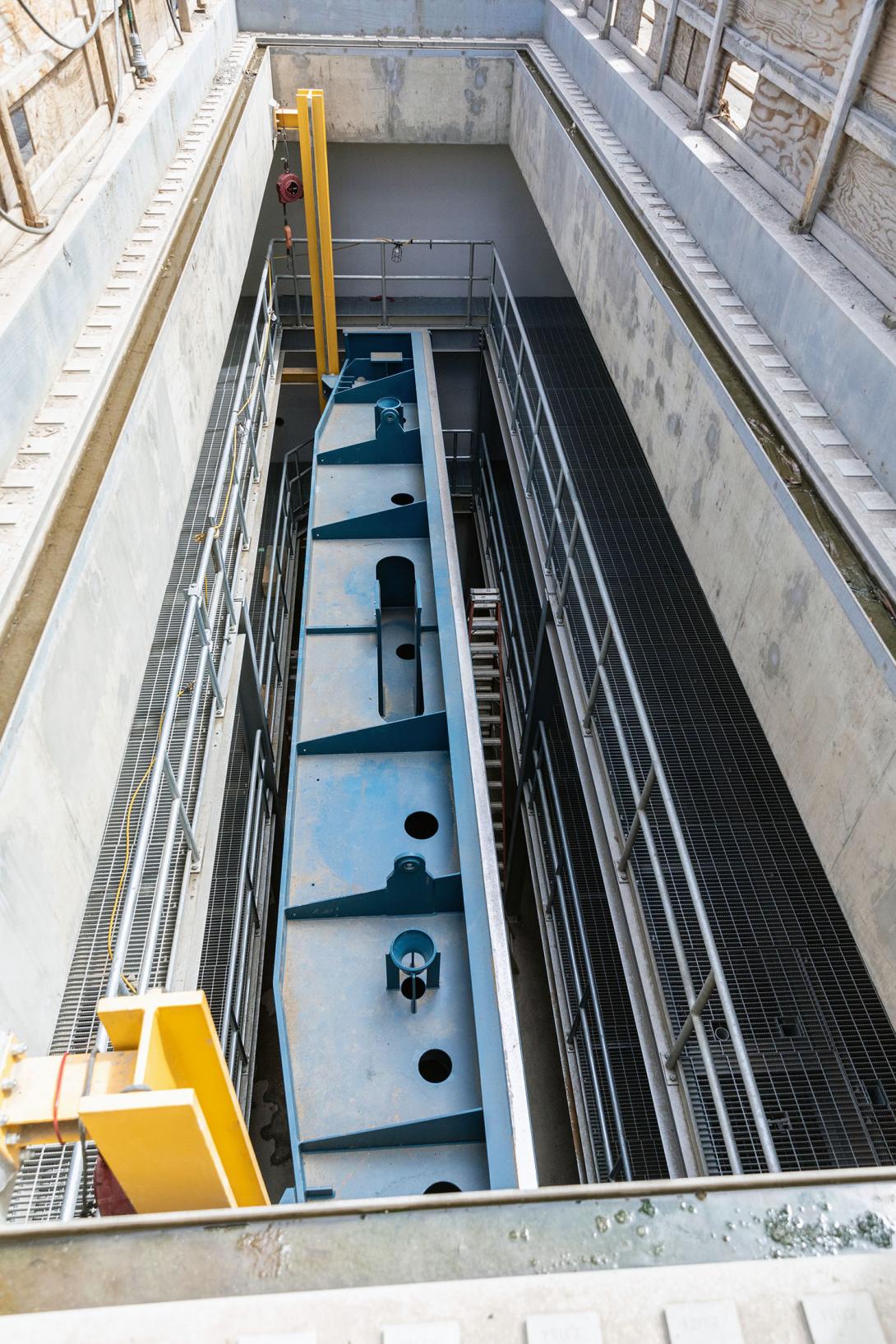 One of six intake gates inserted in the storage chamber above the gate. The gate closes the entrance to the penstock for maintenance by stopping the flow of water from the approach channel. | May 2023
