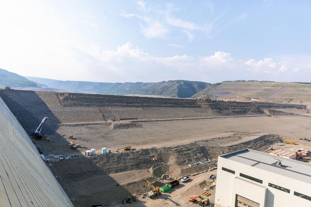 The earthfill dam nears completion. | July 2023