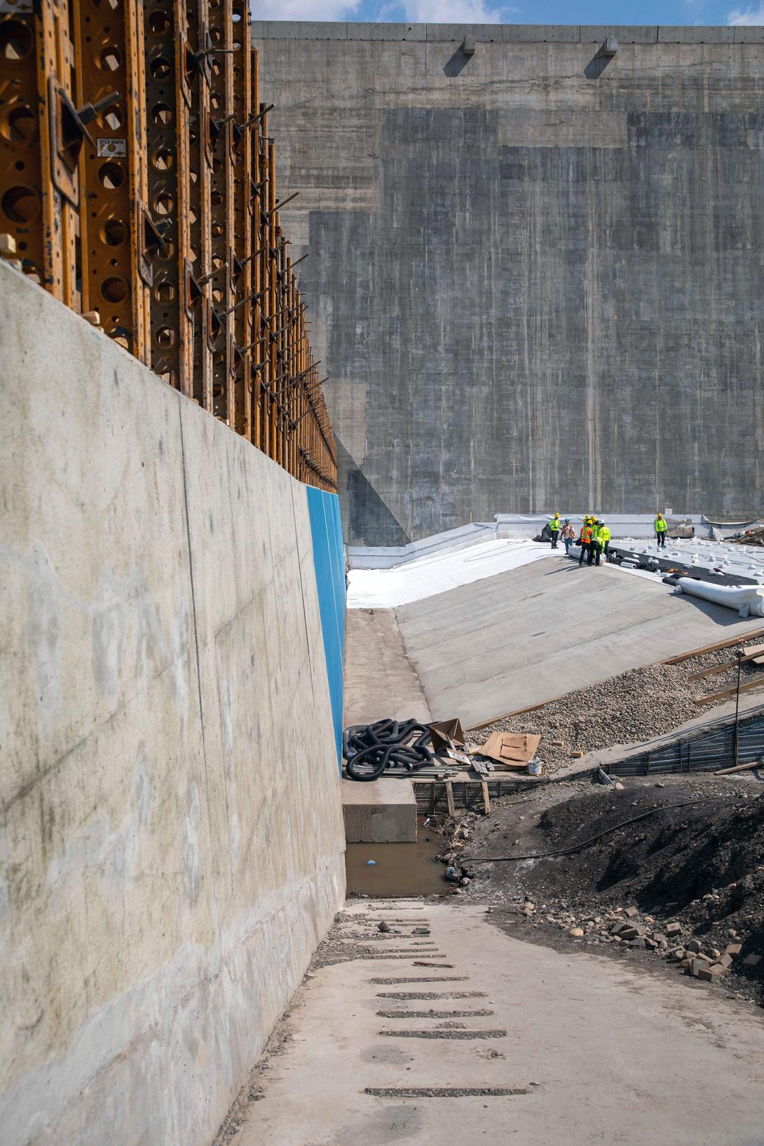 Looking along the drainage gallery extension from the approach channel to the dam and core buttress. This area will be covered with a waterproof liner and backfilled. | June 2023