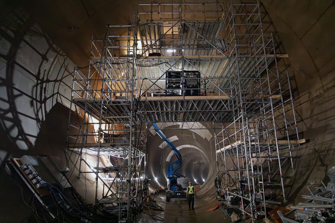 Scaffolding is in place in the diversion tunnel so workers can install the rings needed to slow the flow of water. This starts the process of conversion for reservoir filling. | July 2023