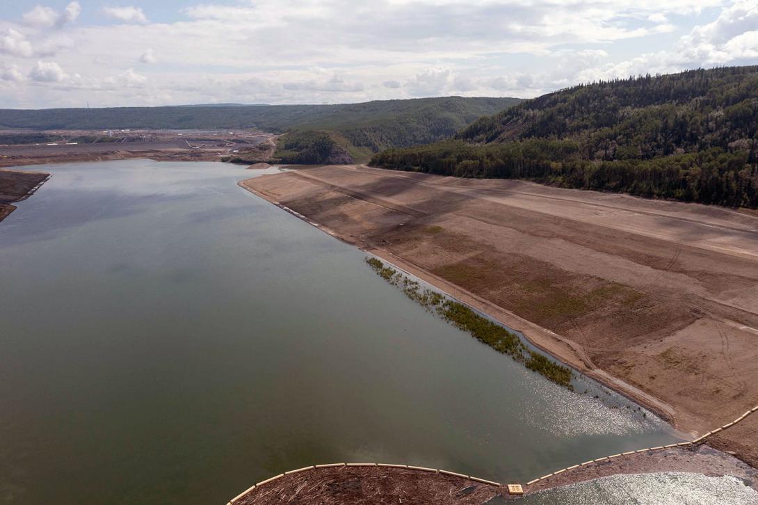 Facing downstream from the temporary debris boom. The area has been prepared for reservoir filling. | August 2023