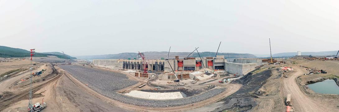 Construction continues on the dam buttress, intakes, mechanical spillways, the auxiliary spillway, and the spillway end-wall.