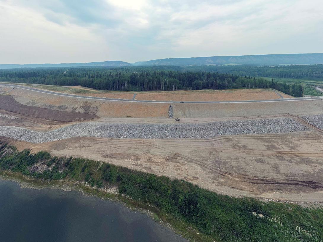 Rock armouring, or riprap, protects the reservoir shoreline from erosion at the Lynx Creek Bridge on Highway 29. | July 2023